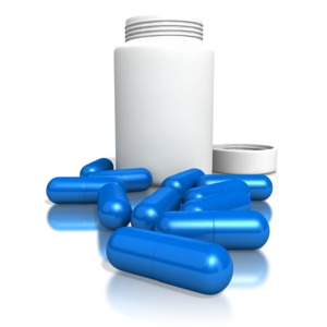 Blank Pill Bottle With Blue Pills PowerPoint clipart graphic preview.