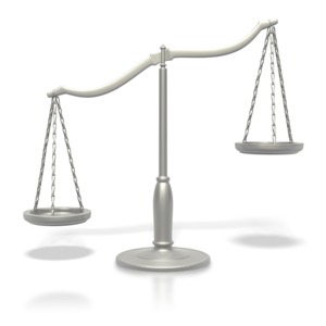 Justice Scale Tipped PowerPoint clipart graphic preview.