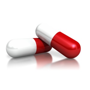 Two Red White Capsules PowerPoint clipart graphic preview.