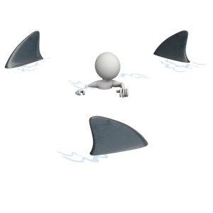 Figure Surrounded By Sharks PowerPoint clipart graphic preview.