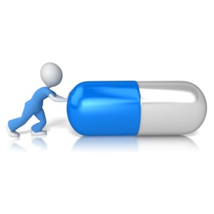 Nurse or Doctor Figure Pushing Pill PowerPoint clipart graphic preview.