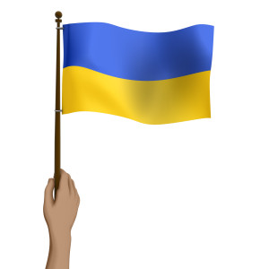 Holding Up Flag of Ukraine PowerPoint clipart graphic preview.