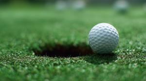 A Background Image of a Golf Ball Near Hole PowerPoint clipart graphic preview.